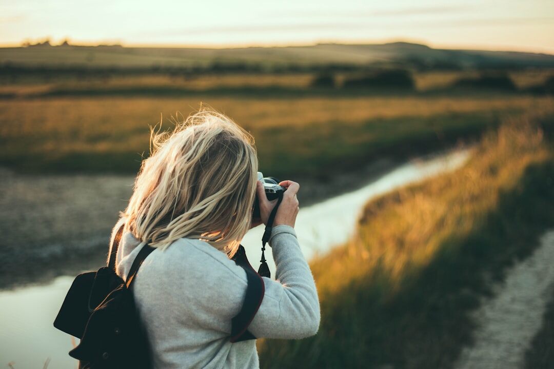 Danish female documentary photographer in her 30s holding a camera