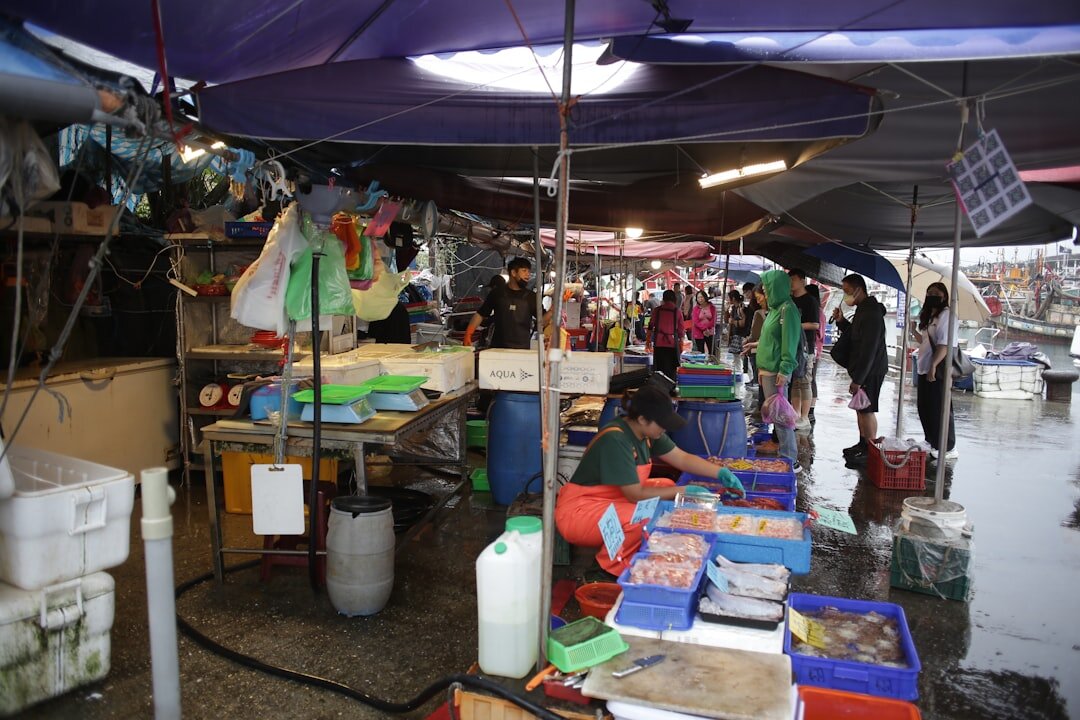 Vendors and customers at a local outdoor market in Denmark